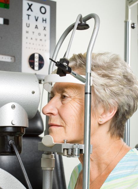 Older woman getting her eyes checked