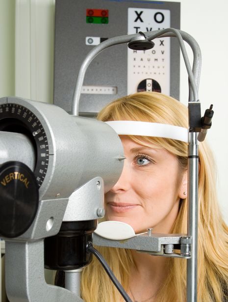 Woman receiving an eye exam