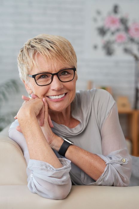 Smiling, happy older woman wearing glasses