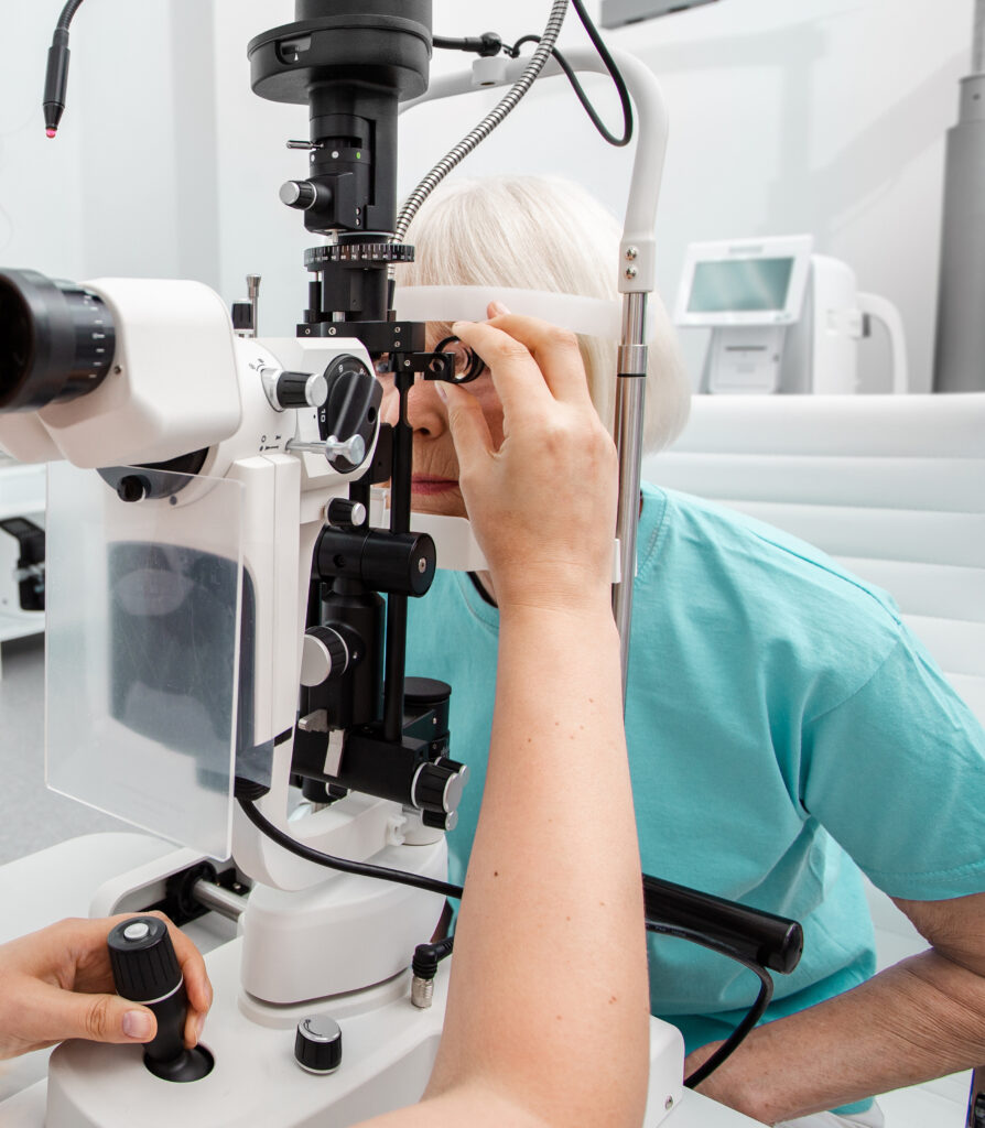 Senior woman examined by an ophthalmologist on ophthalmic equipment, eye exam, eye test