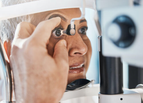 Photo of an older woman getting an eye exam to check for glaucoma