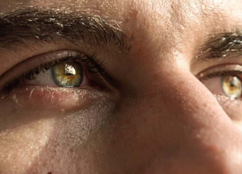 Photo of a man's greenish brown eyes