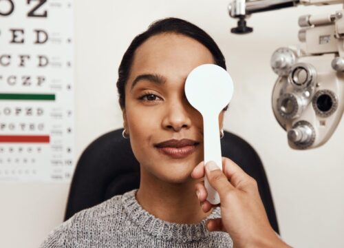 Photo of a woman getting an eye exam for National Eye Exam Month